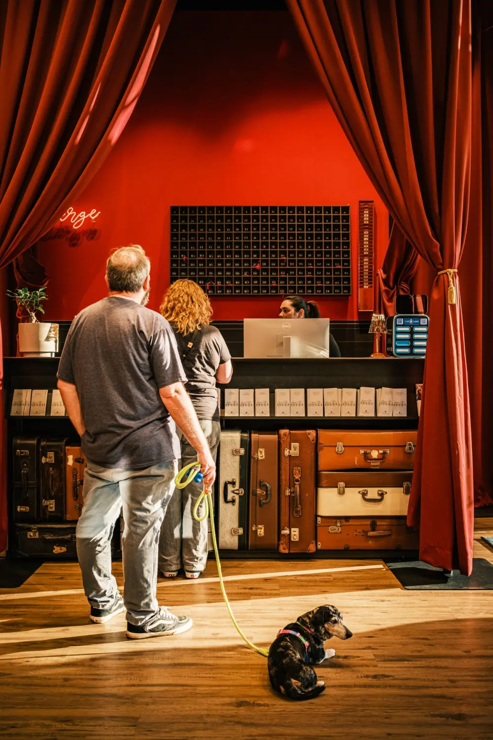 Guests checking in at a hotel reception desk